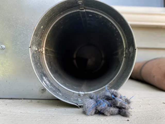 Stevenson Ranch Dryer Vent Cleaning technician using specialized equipment to clear severe dryer vent blockage in Stevenson Ranch